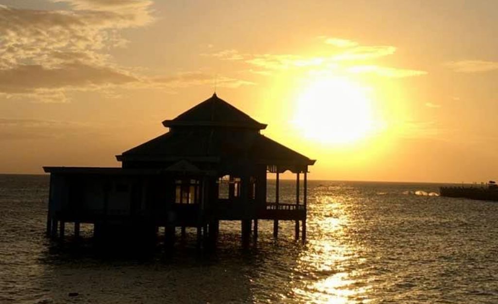 Tourists enjoying sunset at Cape Ca Mau
