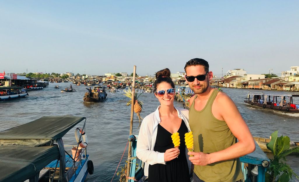 A couple relaxing and smiling in the nature of the Mekong Delta, a tour suitable for everyone.